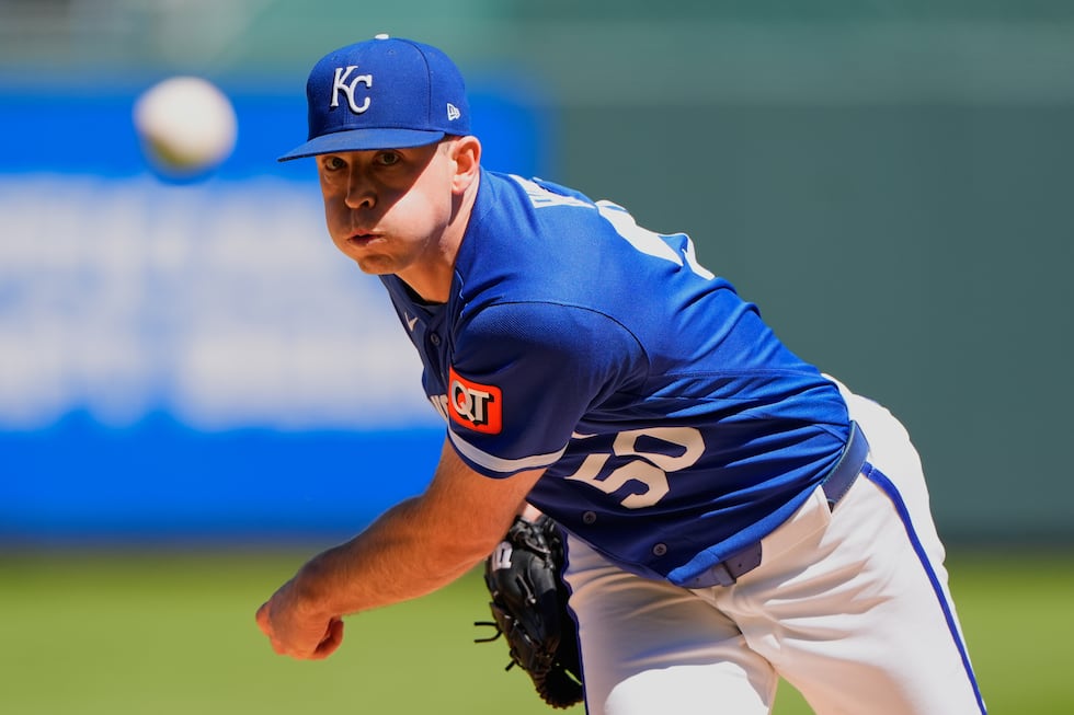 Kansas City Royals starting pitcher Kris Bubic throws during the first inning of a baseball...