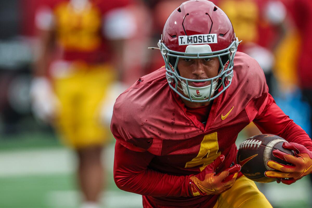 USC freshman wide receiver Trent Mosley takes part in drills during spring practice on March 10.