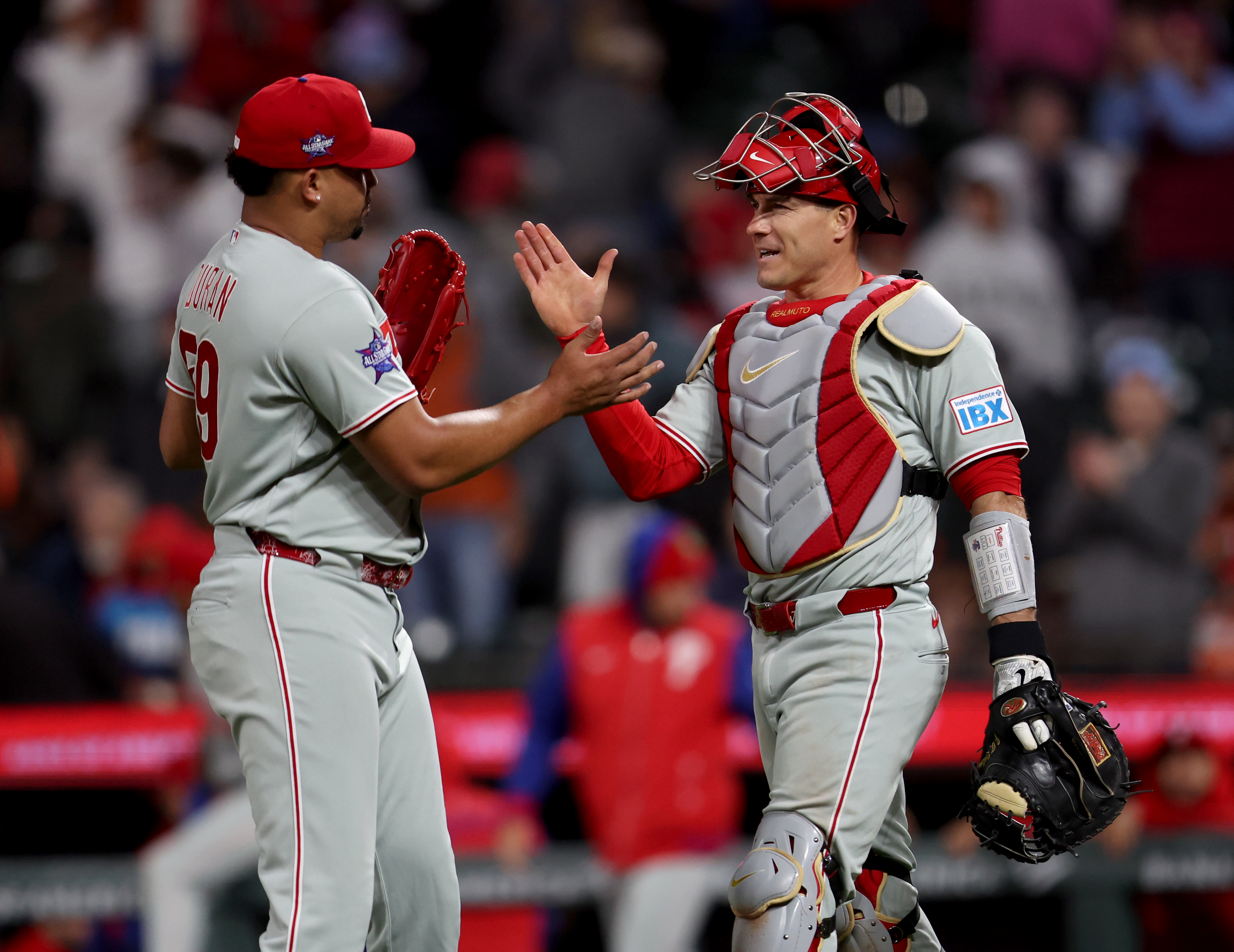 Philadelphia Phillies relief pitcher Jhoan Duran #59 and catcher J.T....