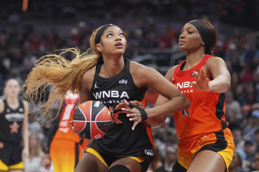 The Sky's Angel Reese, left, shoots against Washington Mystics' Kiki Iriafen during the second half of the WNBA All-Star Game, Saturday, July 19, 2025, in Indianapolis. 