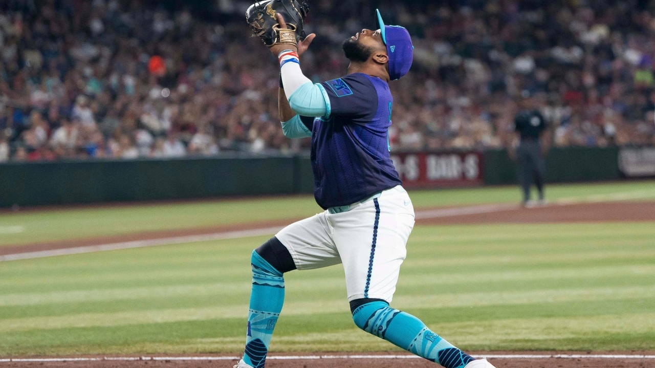 Diamondbacks put Carlos Santana on injured list with adductor strain, select Luken Baker