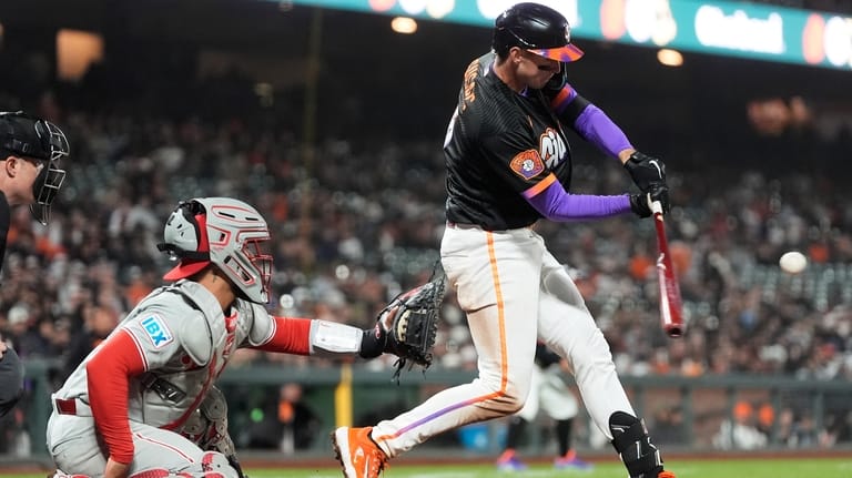 San Francisco Giants' Daniel Susac, right, hits a two-run triple...