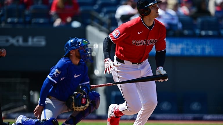 Cleveland Guardians' Chase DeLauter watches his ball after hitting a...
