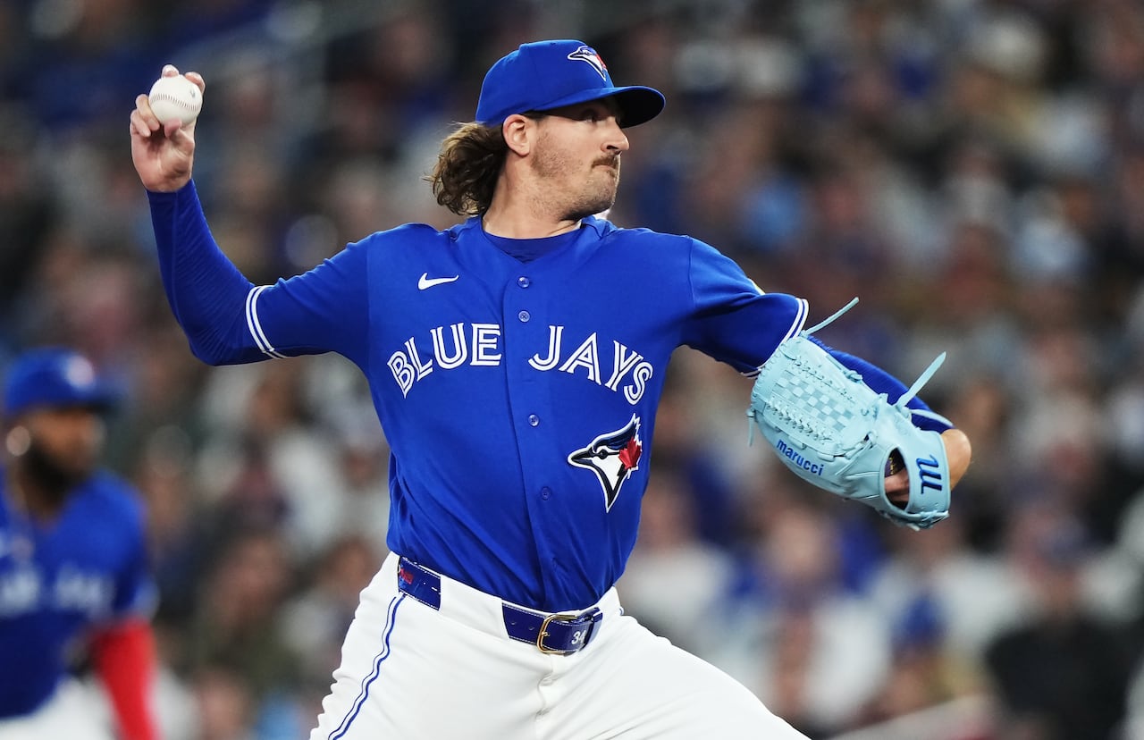 Toronto Blue Jays starting pitcher Kevin Gausman throwing a pitch off the mound