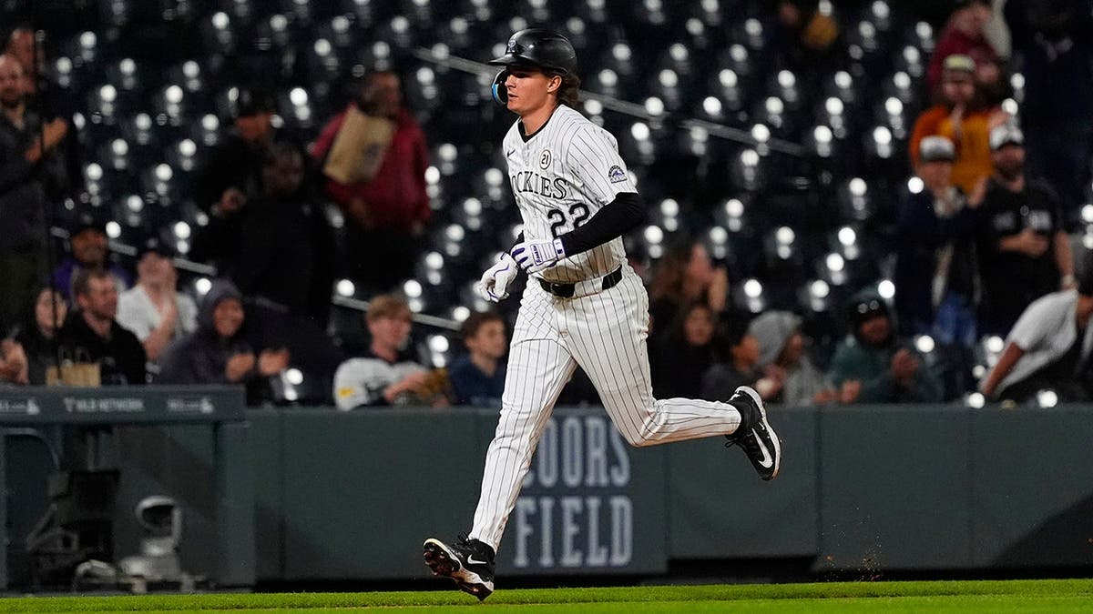 Colorado Rockies right fielder Mickey Moniak running after hitting a home run at Coors Field