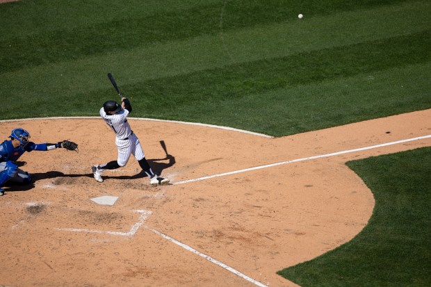 Chicago White Sox left fielder Austin Hays (21) hits a fly ball out to left field during the seventh inning of a game against the Toronto Blue Jays at Rate Field on Sunday, April 5, 2026. (Josh Boland/Chicago Tribune)