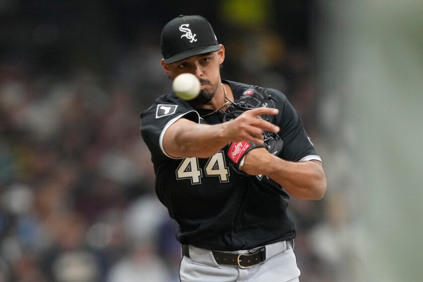 White Sox pitcher Jordan Hicks attempts to pick off the runner at first base during the sixth inning of an Opening Day game against the Brewers on Thursday, March 26, 2026, in Milwaukee. 