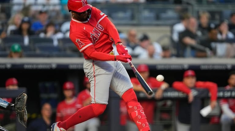 Los Angeles Angels' Jorge Soler (12) hits a home run...