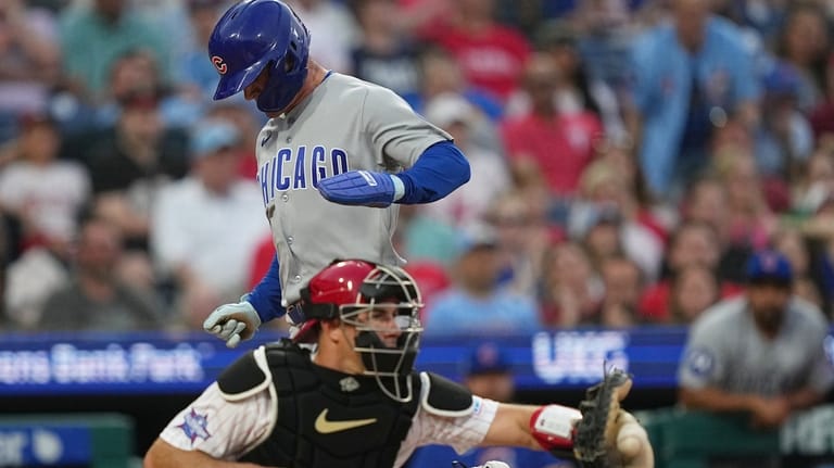 Chicago Cubs' Matt Shaw scores past Philadelphia Phillies catcher J.T....