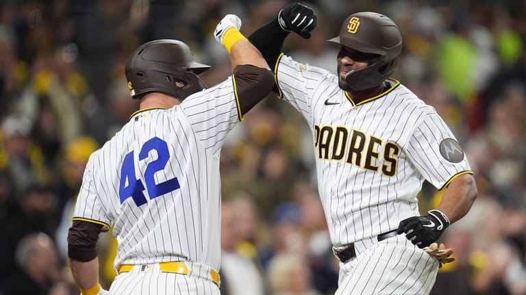 San Diego Padres' Xander Bogaerts, right, celebrates his two-run home...