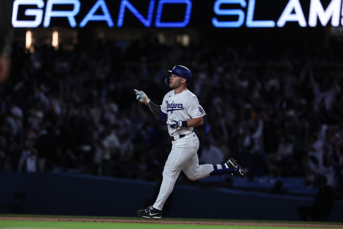 Dalton Rushing rounds the bases after an eighth inning grand slam.