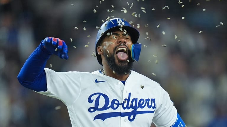 Los Angeles Dodgers' Teoscar Hernández celebrate his home run during...