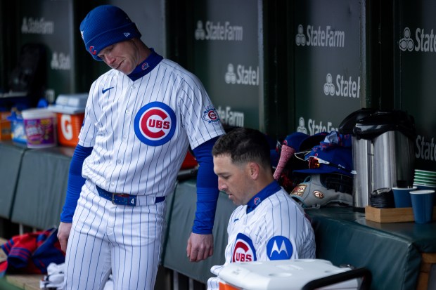 Chicago Cubs center fielder Pete Crow-Armstrong and Chicago Cubs third baseman Alex Bregman look at film in the dugout during the fifth inning of a game against the Los Angeles Angels at Wrigley Field in Chicago on Wednesday, April 1, 2026. (Josh Boland/Chicago Tribune)