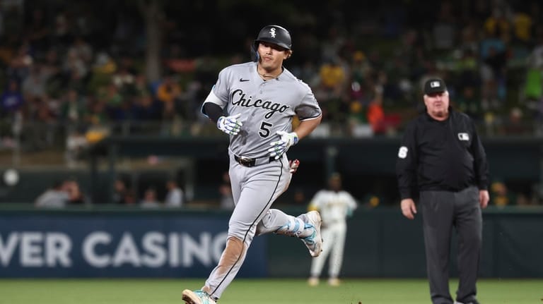 Chicago White Sox's Munetaka Murakami runs the bases after hitting...