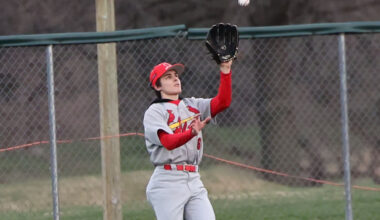 Alton's Grant Ely makes a catch in a March 17 baseball game vs. Marquette Catholic at Hopkins Field in Alton. Ely played in the Busch Stadium outfield on Friday against Father McGivney in St. Louis. 