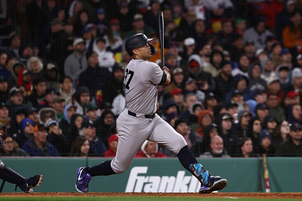 BOSTON, MA - APRIL 21: Giancarlo Stanton #27 of the New York Yankees follows through on a two-run double against the Boston Red Sox during the sixth inning at Fenway Park on April 21, 2026 in Boston, Massachusetts. (Photo By Winslow Townson/Getty Images)