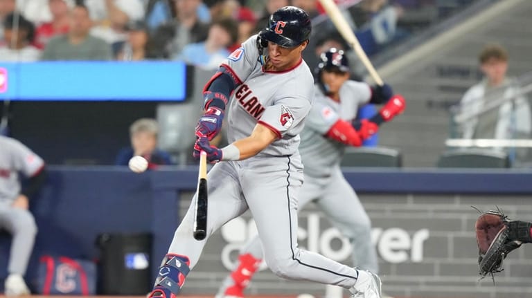 Cleveland Guardians' Juan Brito hits a double off Toronto Blue...