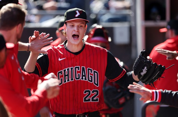 White Sox starter Noah Schultz high-fives teammates in the dugout after getting out of a jam in the third inning against the Nationals on April 25, 2026, at Rate Field. (Chris Sweda/Chicago Tribune)