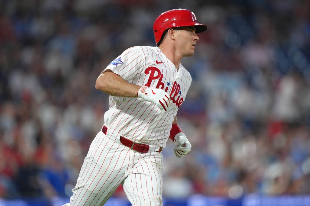 Philadelphia Phillies catcher JT Realmuto (10) runs to first after hitting a single against the Chicago Cubs in the fourth inning at Citizens Bank Park. 