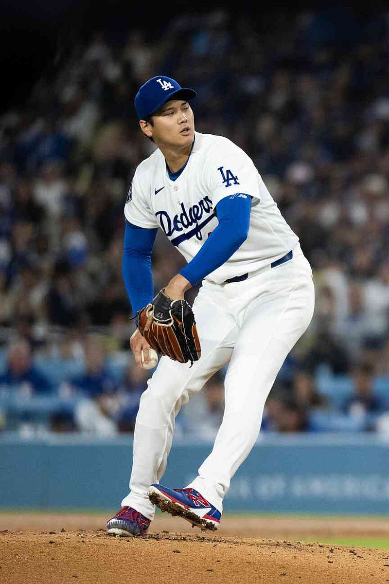 Los Angeles Dodgers starting pitcher Shohei Ohtani delivers during the second inning of a baseball game against the Cleveland Guardians in Los Angeles, Tuesday, March 31, 2026. (AP Photo/Kyusung Gong)