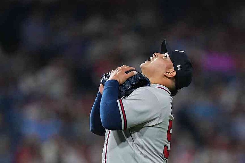 Atlanta Braves pitcher José Suarez reacts after a winning baseball game against the Philadelphia Phillies, Friday, April 17, 2026, in Philadelphia. (AP Photo/Matt Rourke)