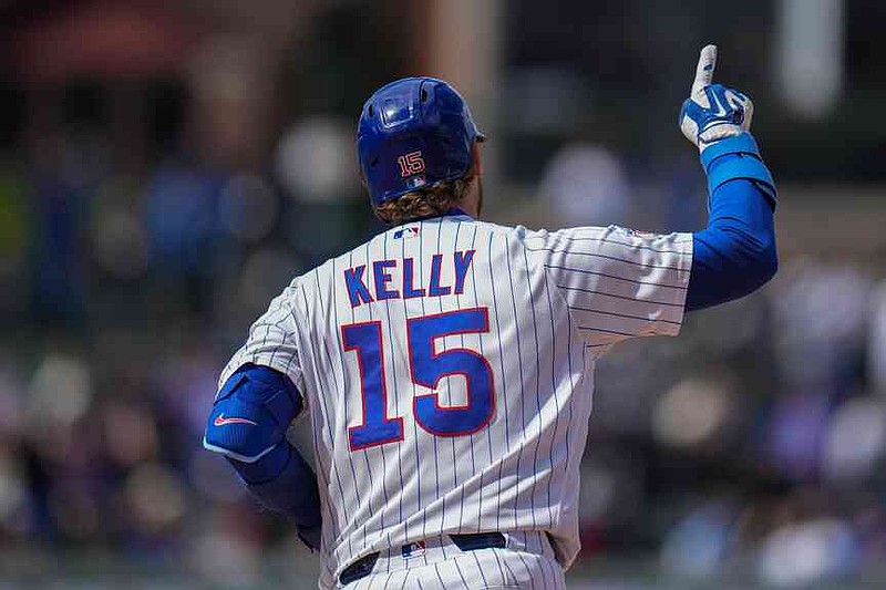 Chicago Cubs' Carson Kelly (15) runs the bases after hitting a three-run home run during the sixth inning of a baseball game against the New York Mets, Saturday, April 18, 2026, in Chicago. (AP Photo/Erin Hooley)