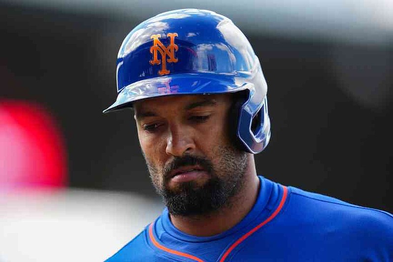 New York Mets' Marcus Semien returns to the dugout after being flying out to left field in the seventh inning of a baseball game against the Chicago Cubs, Saturday, April 18, 2026, in Chicago. (AP Photo/Erin Hooley)
