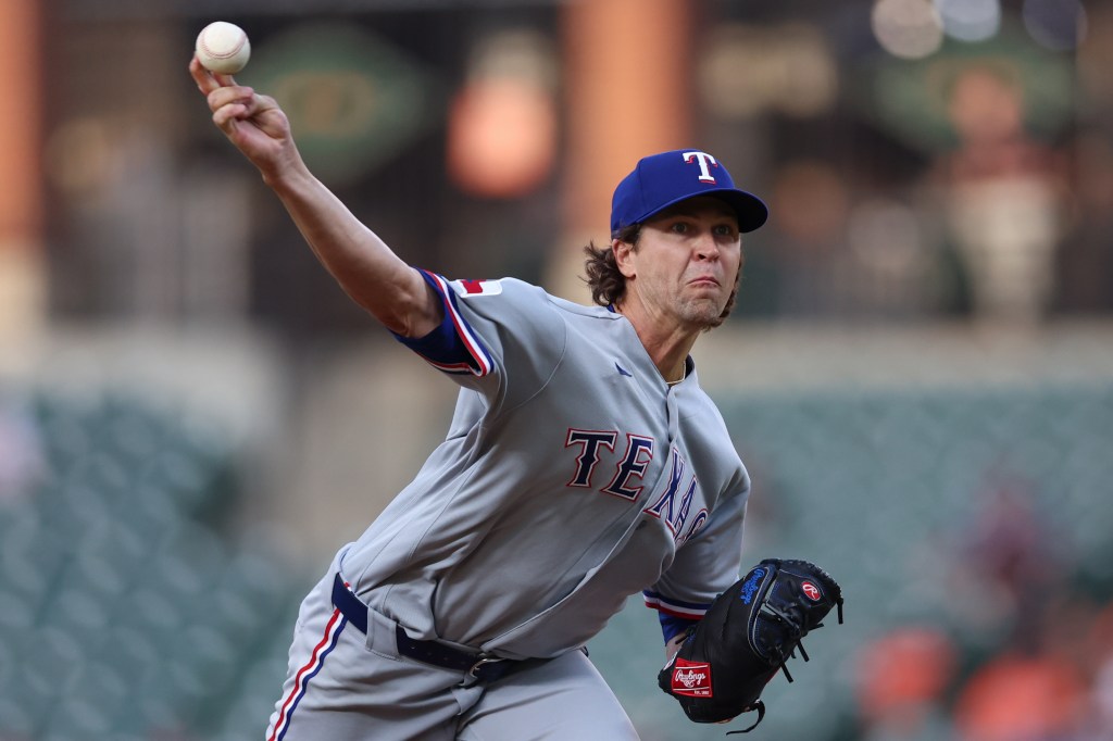 Texas Rangers pitcher throwing a baseball.