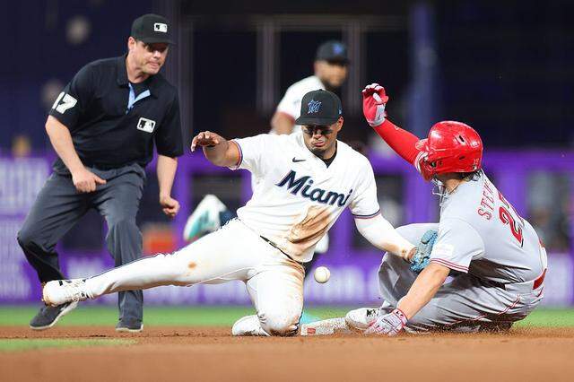 MIAMI, FLORIDA - APRIL 06: Sal Stewart #27 of the Cincinnati Reds slides to second base against Leo Jiménez #19 of the Miami Marlins in the fourth inning of the game at loanDepot park on April 06, 2026 in Miami, Florida. (Photo by Megan Briggs/Getty Images)