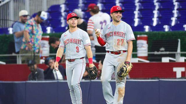 MIAMI, FLORIDA - APRIL 06: Matt McLain #9 and Sal Stewart #27 of the Cincinnati Reds celebrate an out against the Miami Marlins in the ninth inning of the game at loanDepot park on April 06, 2026 in Miami, Florida. (Photo by Megan Briggs/Getty Images)
