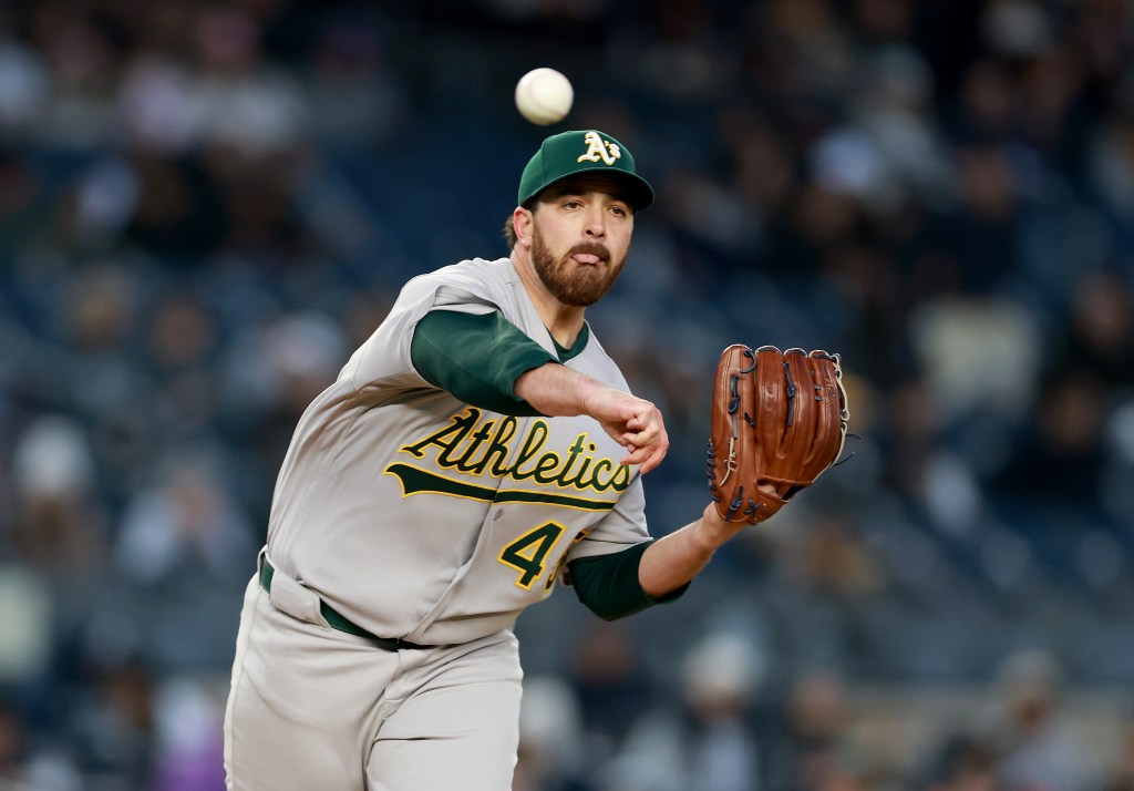 NEW YORK, NEW YORK - APRIL 07: Aaron Civale #45 of the Athletics tries to pick of Aaron Judge #99 of the New York Yankees at first base in the first inning at Yankee Stadium on April 07, 2026 in the Bronx borough of New York City. (Photo by Elsa/Getty Images)