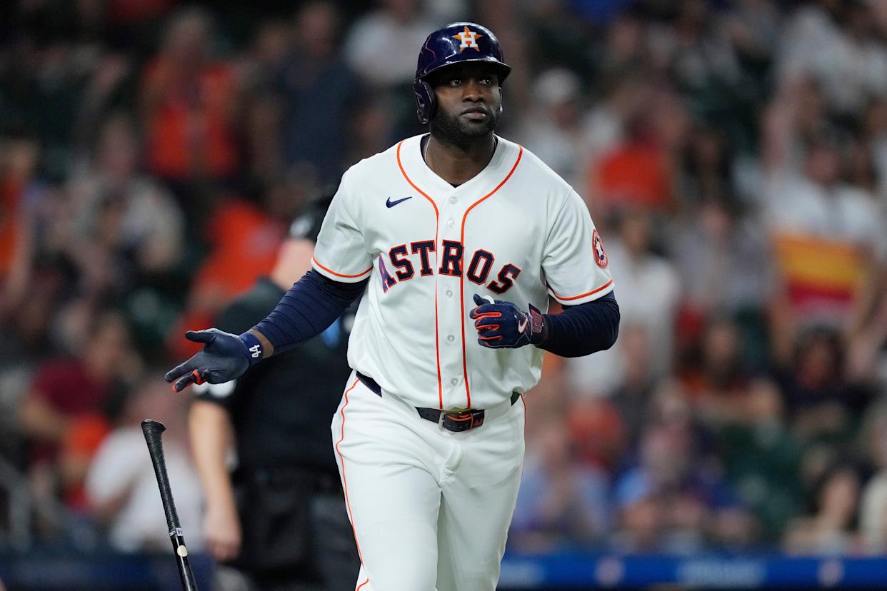 Houston Astros designated hitter Yordan Alvarez tosses his bat after hitting a solo home run during the third inning of a baseball game against the Colorado Rockies, Wednesday, April 15, 2026, in Houston. (AP Photo/Kevin M. Cox)