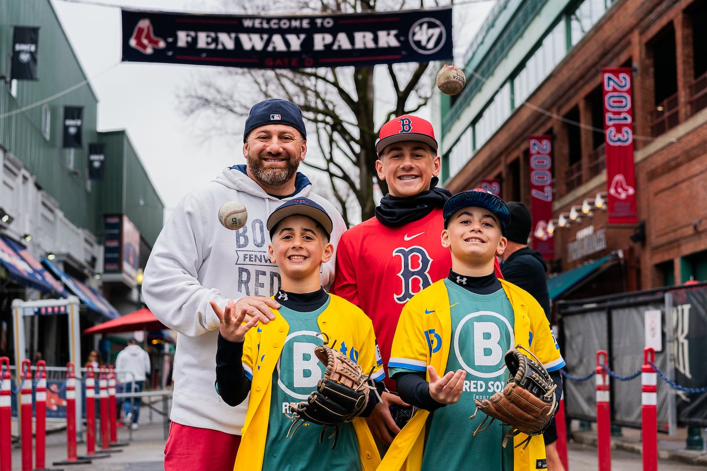 Travis Gonick, 44, and his sons, TJ, 14; Tyler, 11; and Taylor, 11, all of New Jersey, pose for a portrait. “We’re here every year, since they were kids,” Travis said. 