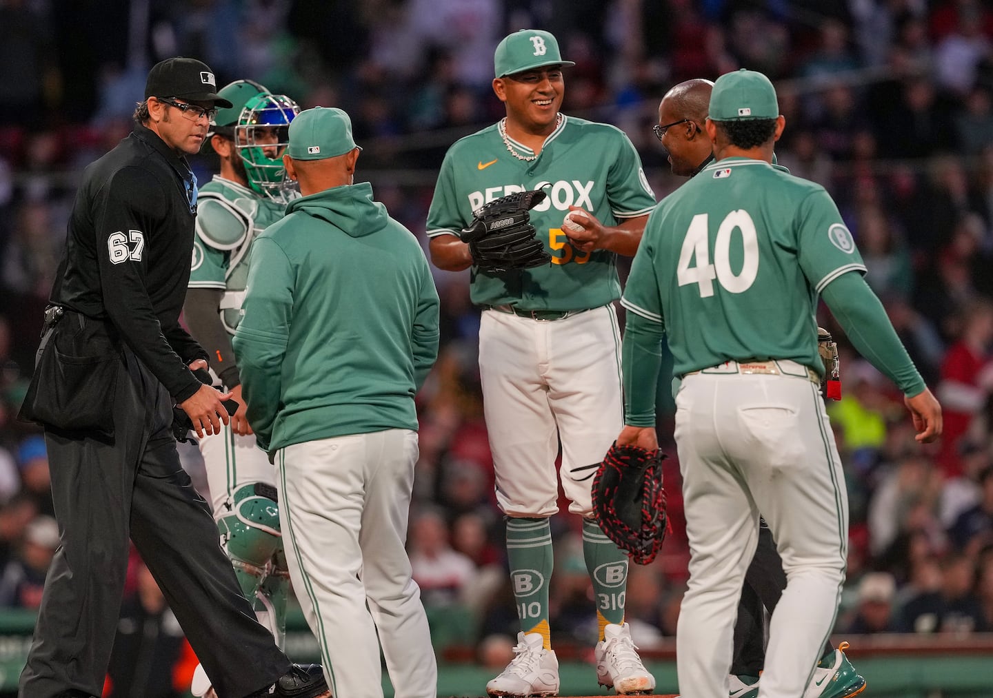 Ranger Suarez (center) waved off medical assistance after he appeared to be struck by a batted ball in the second inning.