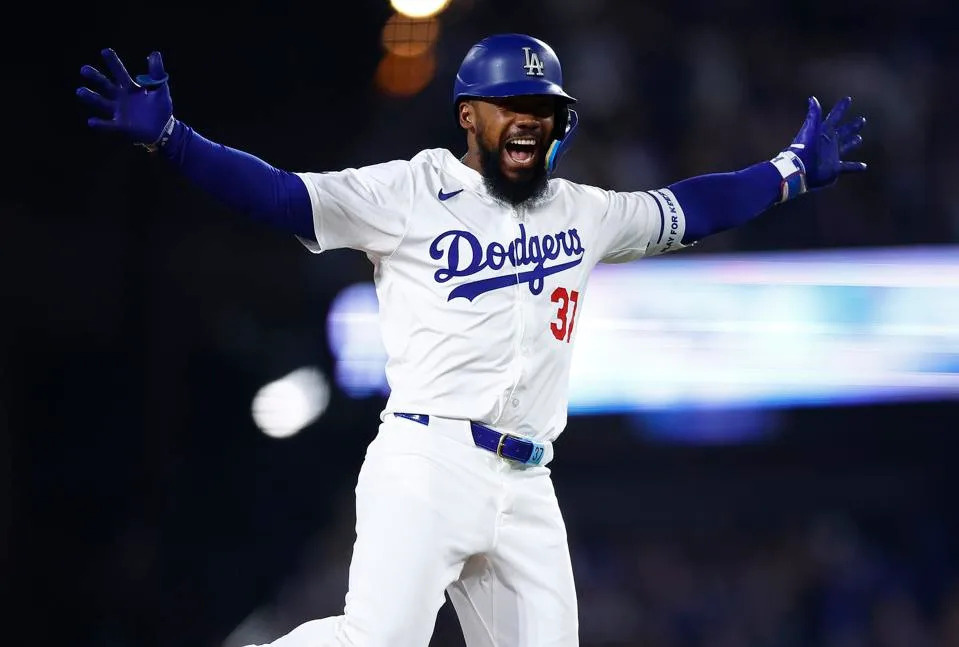 Teoscar Hernandez celebrates.
