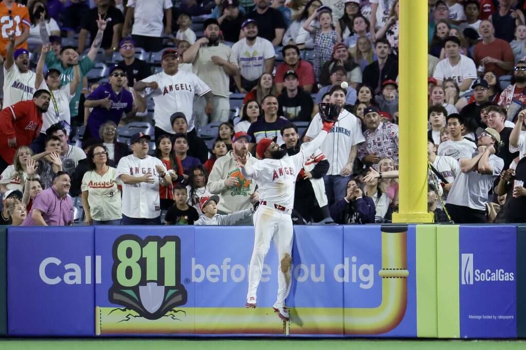 Jo Adell (7) of the Los Angeles Angels catches a fly out by J.P. Crawford of the Seattle Mariners during the ninth inning of a baseball game at Angel Stadium of Anaheim on Saturday, April 4, 2026 in Anaheim, California. (Ryan Sirius Sun / Getty Images / The Athletic)