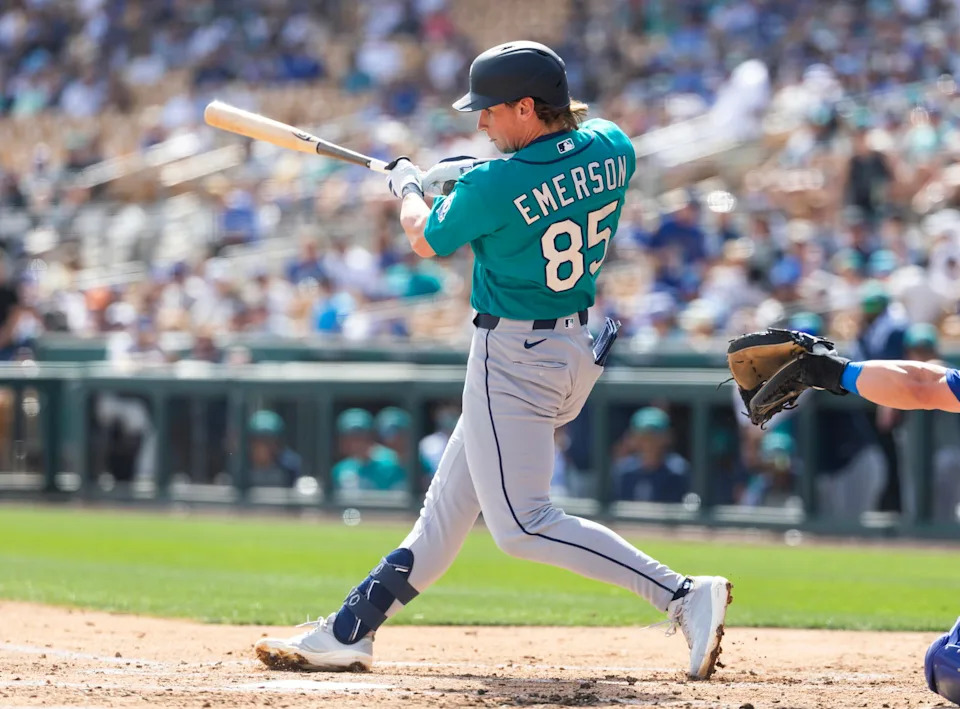 Seattle Mariners shortstop Colt Emerson swings during a spring training game against the Los Angeles Dodgers on Feb. 23 at Camelback Ranch in Glendale, Ariz. -- Mark J. Rebilas/Imagn Images.