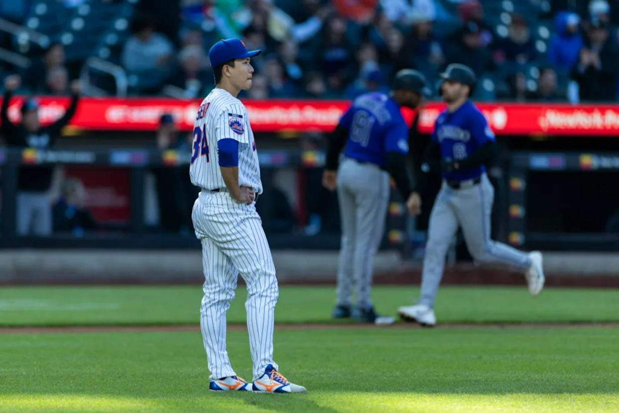 An image collage containing 1 images, Image 1 shows New York Mets pitcher Kodai Senga reacts on the mound after giving up a home run