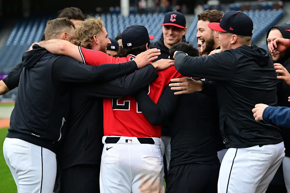 Apr 19, 2026; Cleveland, Ohio, USA; Cleveland Guardians catcher Austin Hedges (27) is congratulated by his teammates after a marriage proposal by Hedges to his fiancée Lexi Dickinson after a game against the Baltimore Orioles at Progressive Field. Mandatory Credit: David Dermer-Imagn Images