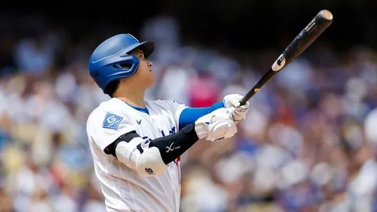 Shohei Ohtani #17 of the Los Angeles Dodgers reacts to his home run during the game against the Texas Rangers at Dodger Stadium on April 12, 2026 in Los Angeles, California.