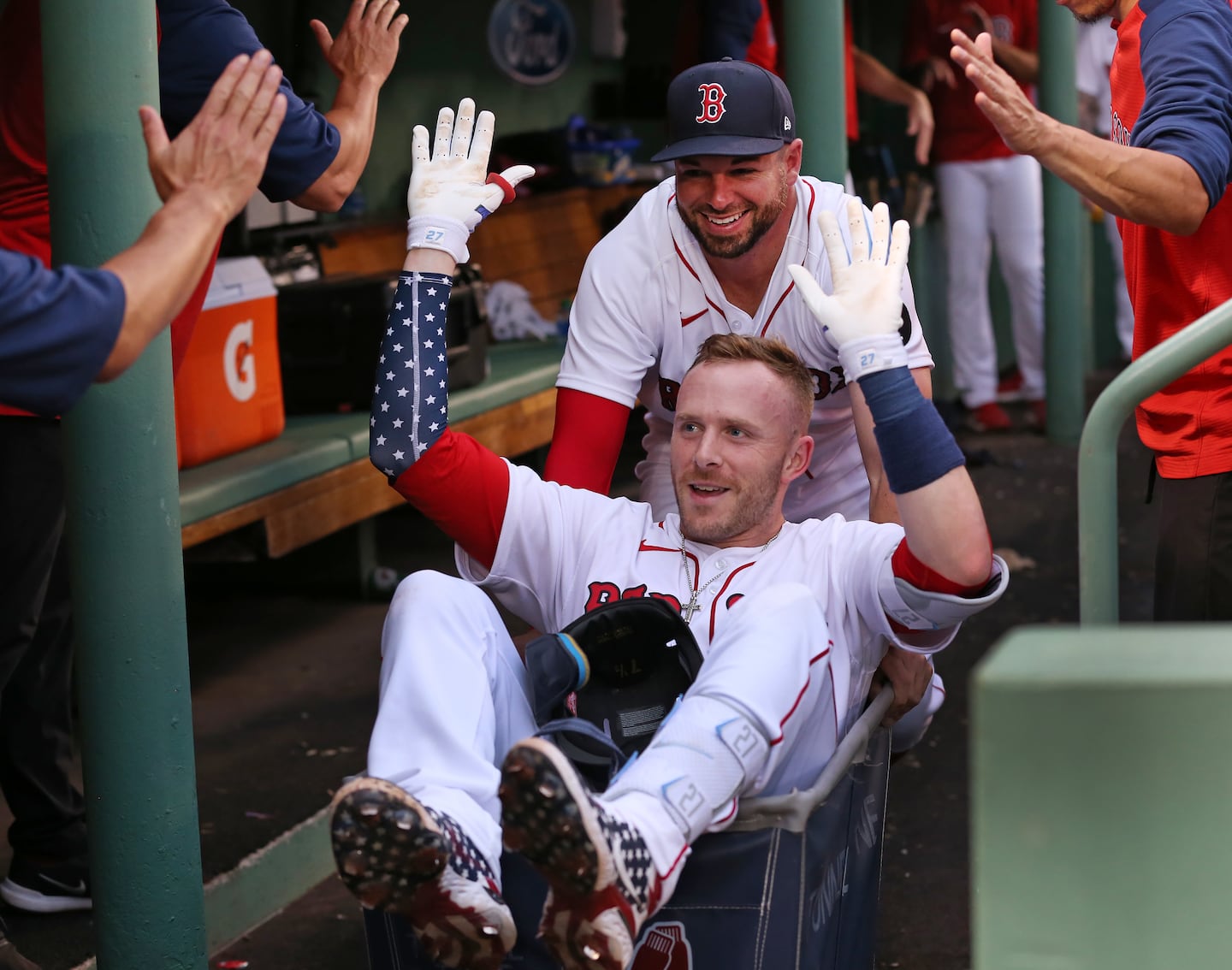 Trevor Story was one of many Red Sox teammates to be given a ride in the home run laundry cart in the dugout by Kevin Plawecki.