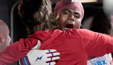 Phils Bryson Stott (left) hugs Felix Reyes after Reyes hit a solo homerun in the second inning of the Atlanta Braves vs. Philadelphia Phillies baseball game at Citizens Bank Park in Philadelphia on Saturday, April 18, 2026. It was Reyes first at bat in the major league.