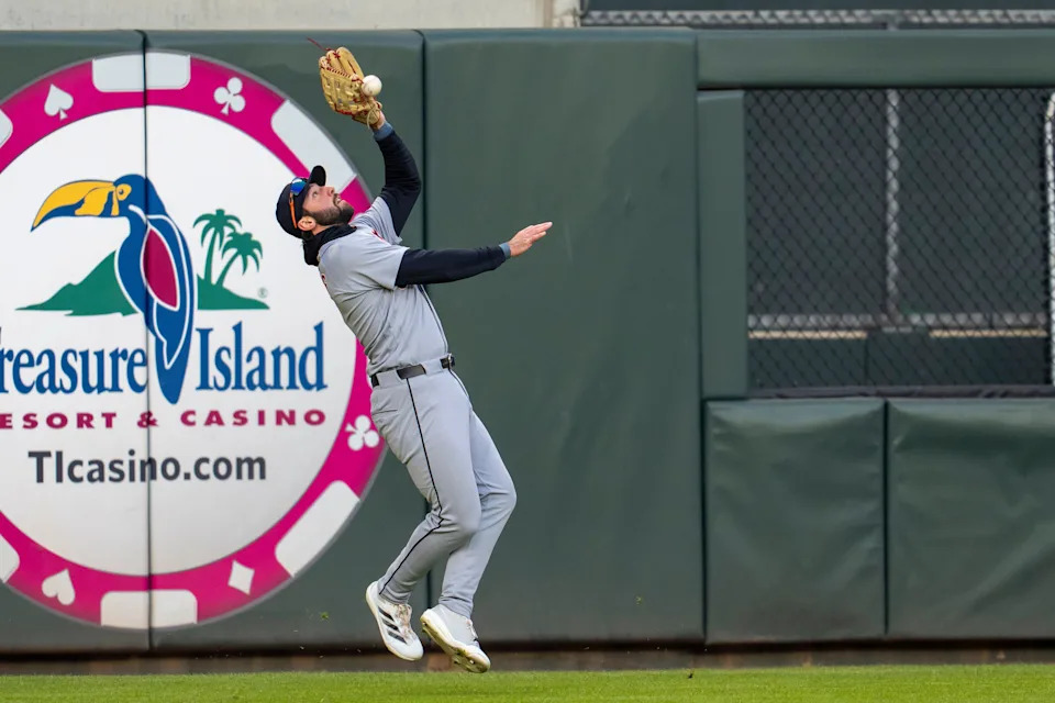 Detroit Tigers left fielder Matt Vierling (8) attempts to catch a fly ball against the Minnesota Twins in the second inning at Target Field in Minneapolis on Monday, April 6, 2026.