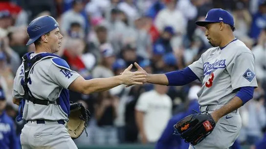 Los Angeles Dodgers pitcher Edwin Daz (3) celebrates with Dodgers catcher Will Smith (16) after the final out against the Washington Nationals at Nationals Park. 
