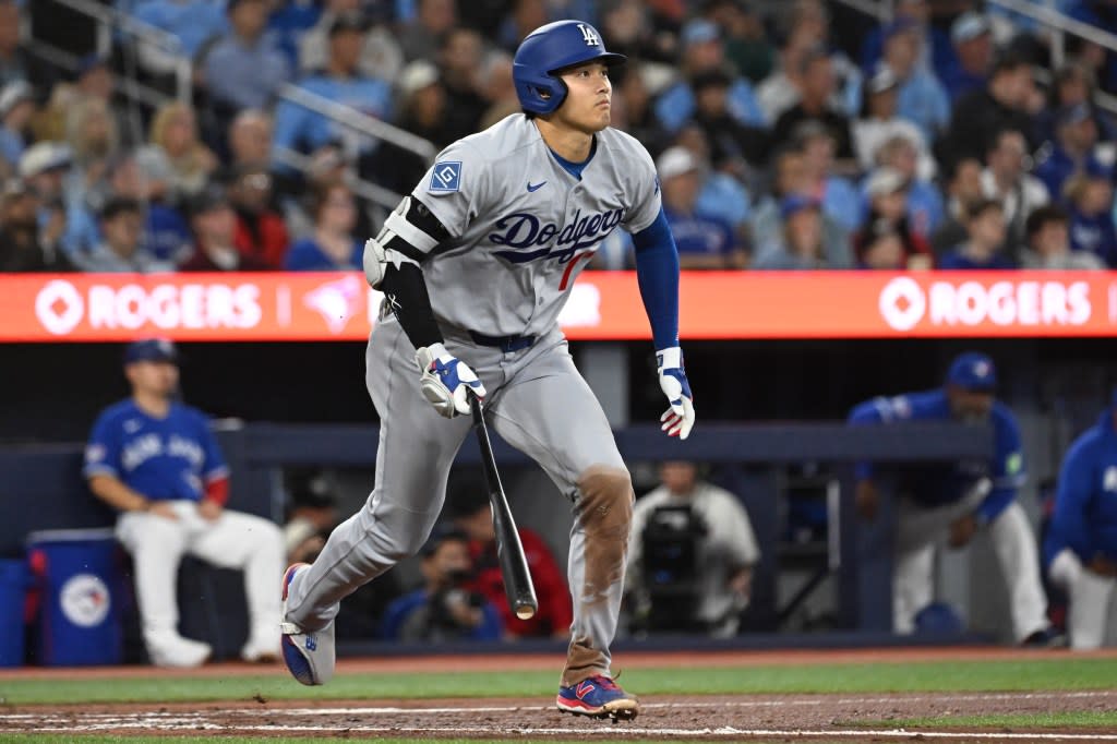 Shohei Ohtani hits a single against the Toronto Blue Jays in the third inning. Dan Hamilton-Imagn Images
