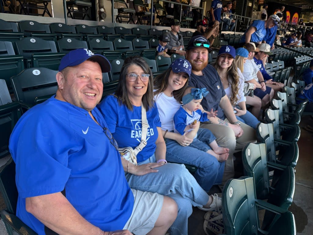 Ryan Ward’s family –– his dad Carl, mother Jenn and fiancee Keely (far right) –– was at Coors Field on Sunday for his debut.