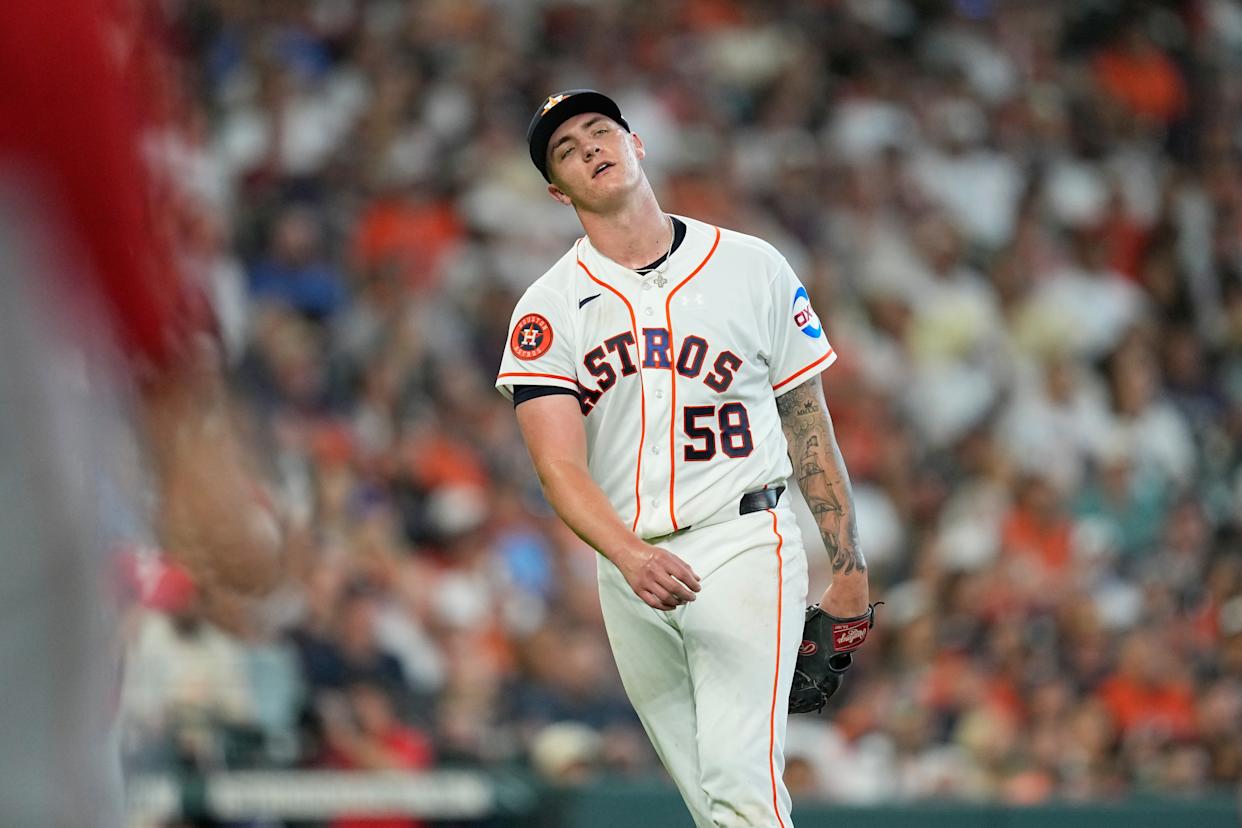 Houston Astros starting pitcher Hunter Brown reacts after giving up a single to Los Angeles Angels' Jorge Soler during the fifth inning of an opening-day baseball game Thursday, March 26, 2026, in Houston.