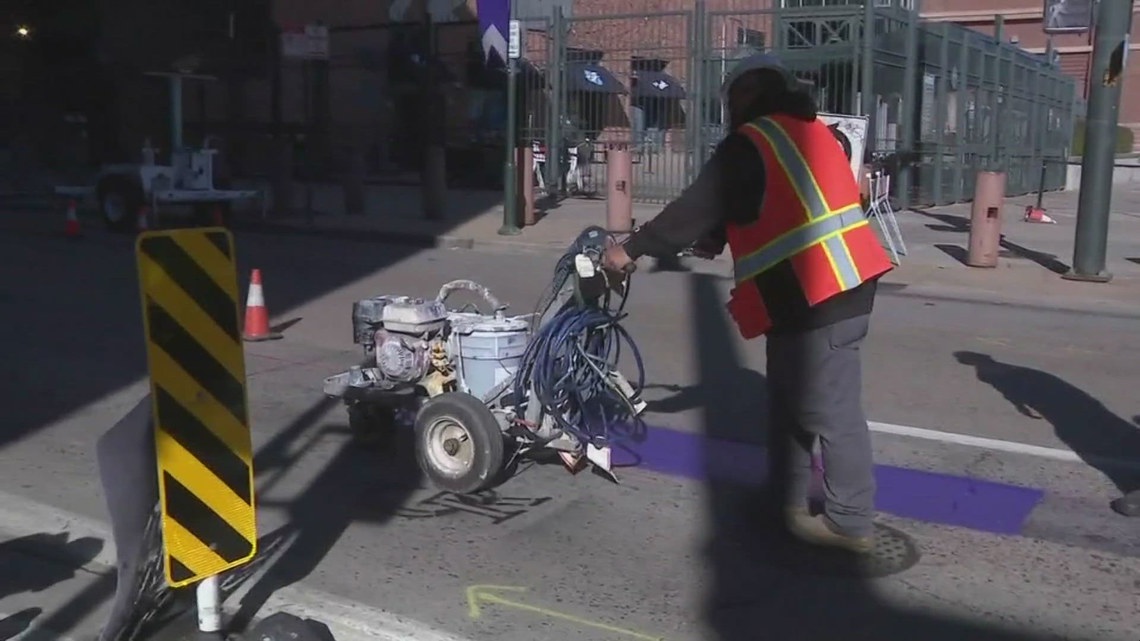 Denver celebrates Rockies home opener with a purple stripe