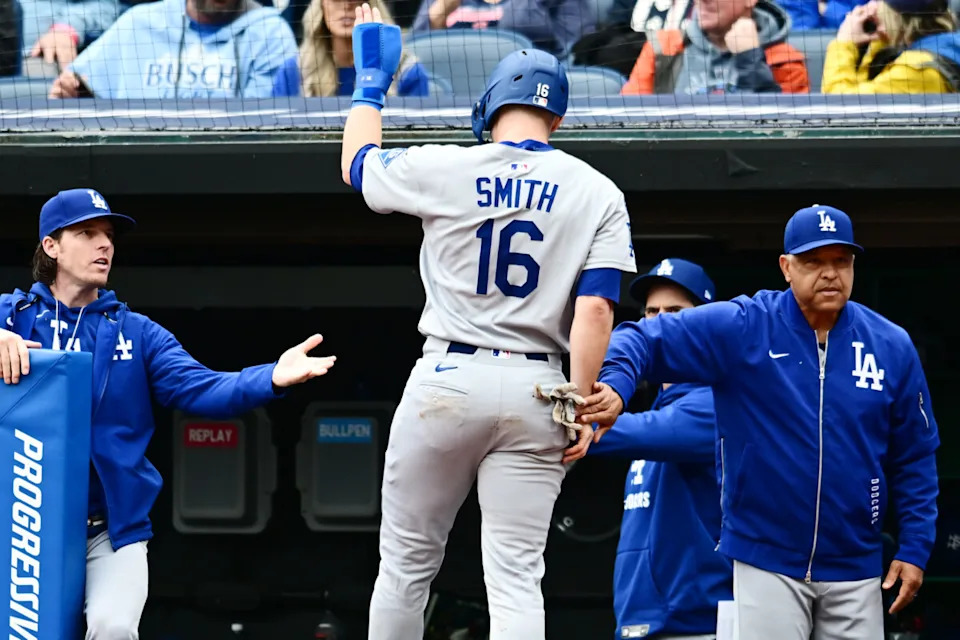 May 28, 2025; Cleveland, Ohio, USA; Los Angeles Dodgers catcher Will Smith (16) celebrates after scoring with manager Dave Roberts, right, during the fourth inning against the Cleveland Guardians at Progressive Field. Mandatory Credit: Ken Blaze-Imagn Images