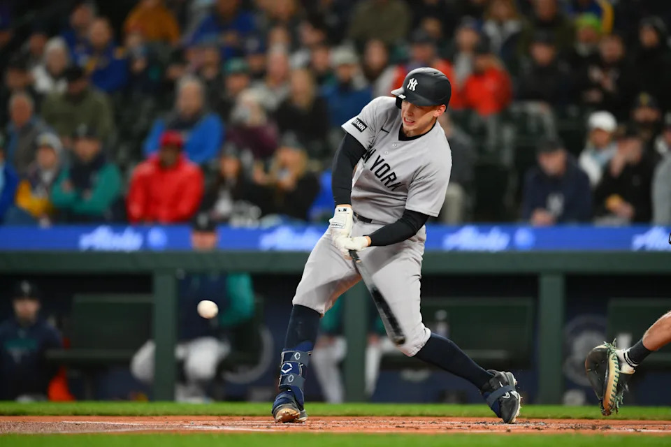 Apr 1, 2026; Seattle, Washington, USA; New York Yankees designated hitter Ben Rice (22) hits a RBI double against the Seattle Mariners during the first inning at T-Mobile Park. Mandatory Credit: Steven Bisig-Imagn Images